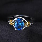 JewelryPalace Love Heart Knot 1.5ct  Natural Blue Topaz Real Diamond Accented 925 Sterling Silver 18K Yellow Gold Ring For Women